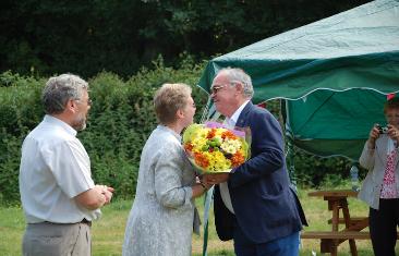 Neil Torkington presenting Penny with a bouquet of flowers